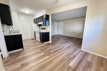 a renovated living room and kitchen with wood flooring at Hunter Ridge Apartments, Cincinnat, 45244